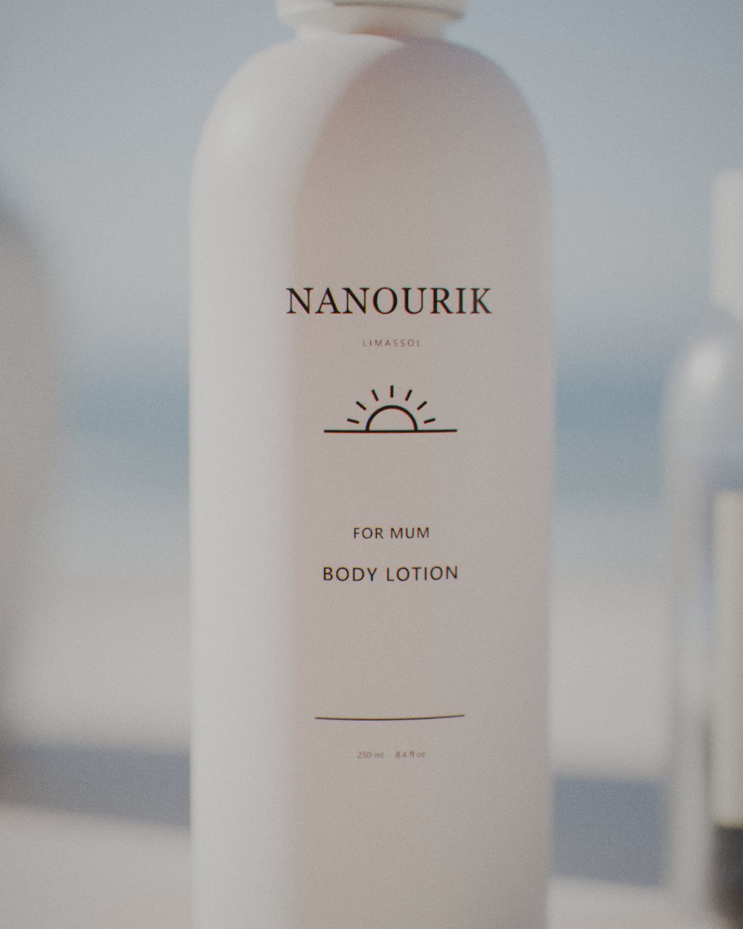 Nanourik body lotion in a white pump bottle